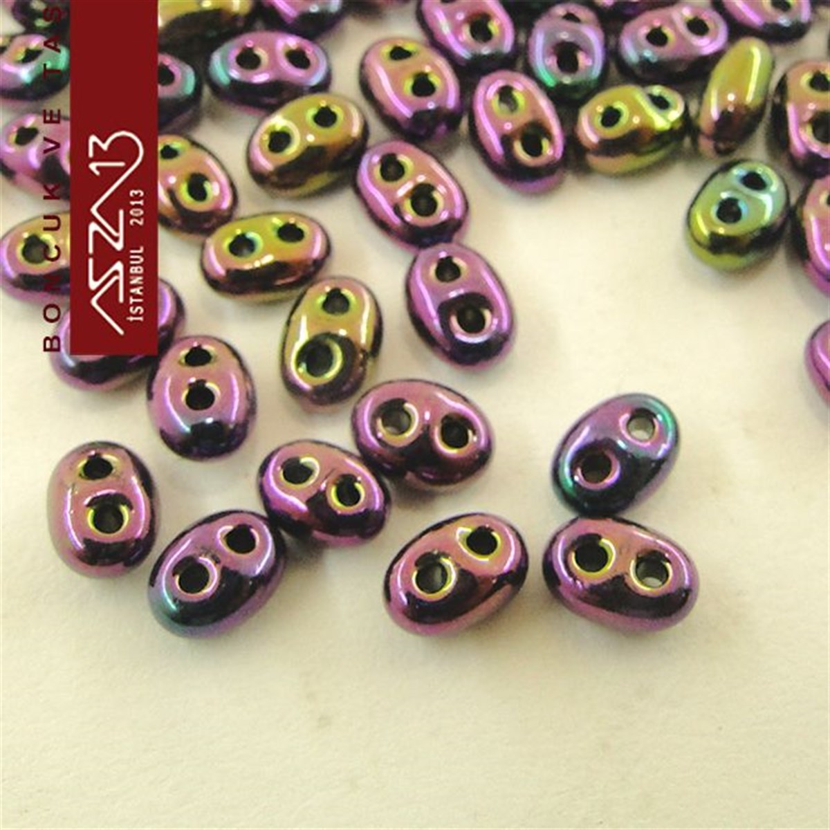 65 Adet 2,5x5 mm Metalik Janjanlı Mor Renkli Twin Cam Boncuk (3,8 gr)