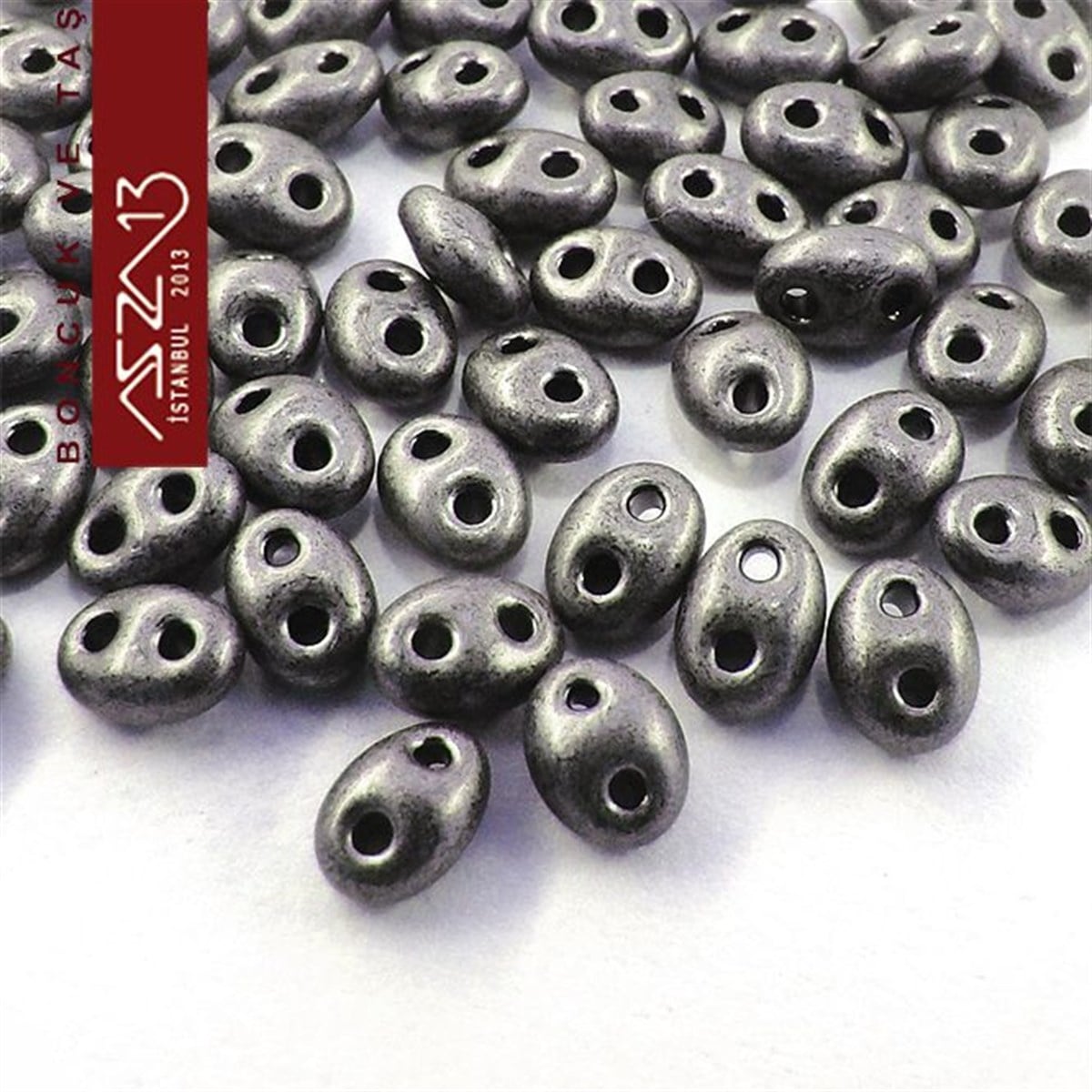 65 Adet 2,5x5 mm Metalik Gri Renkli Twin Cam Boncuk (3,8 gr)