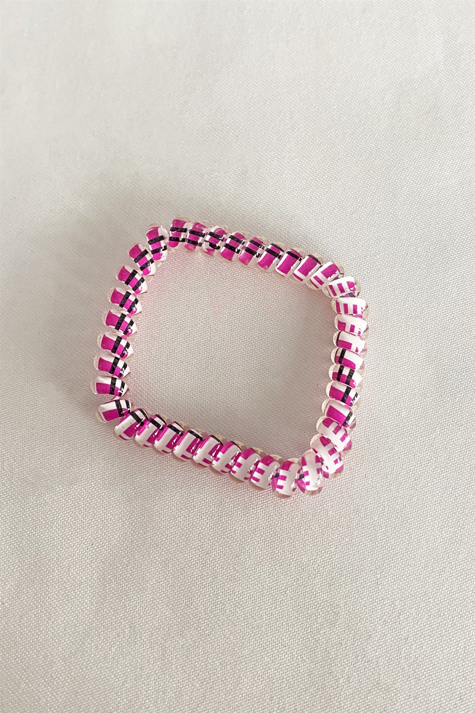Pink color black striped spiral rubber buckle