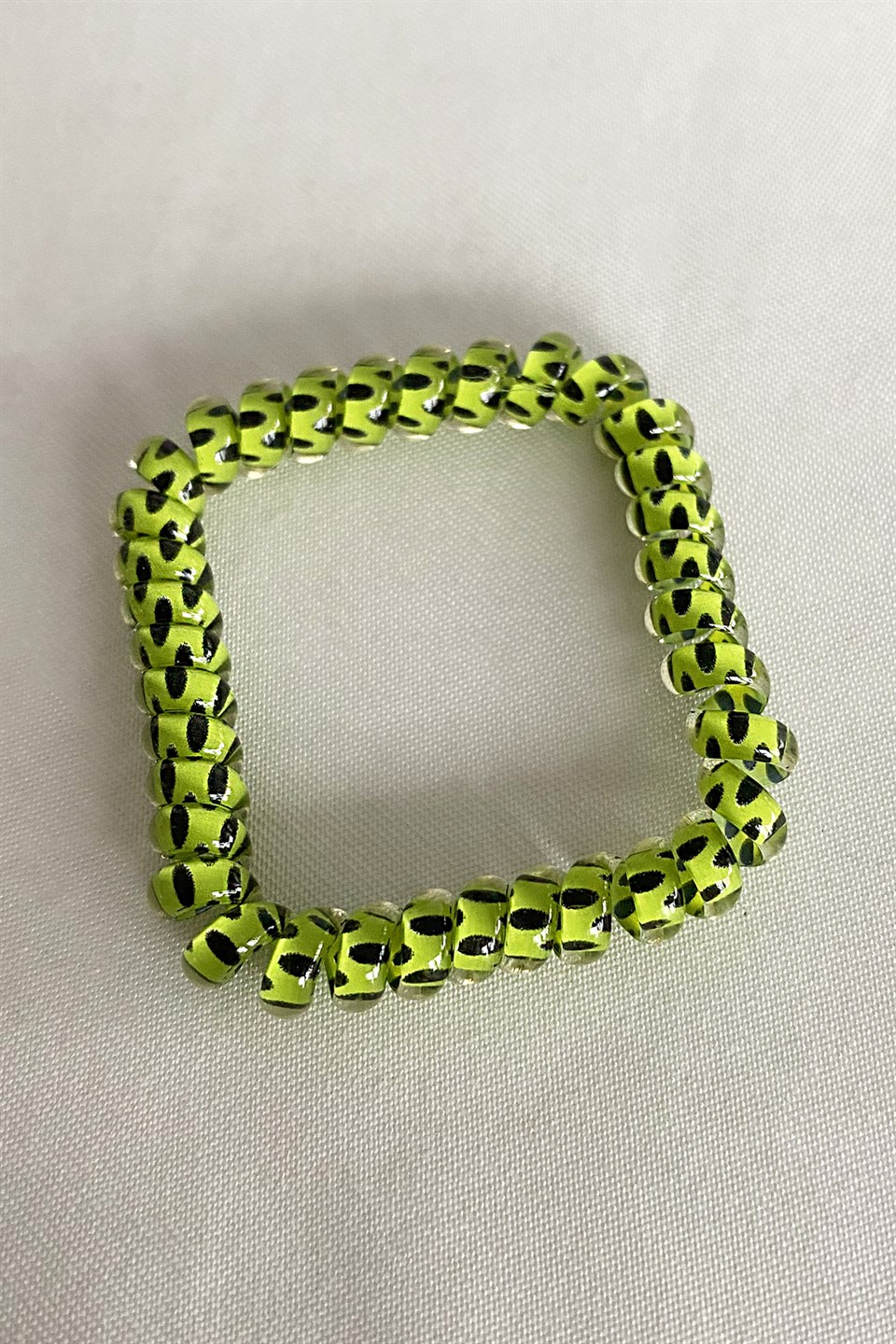 Green color polka dot spiral tire buckle