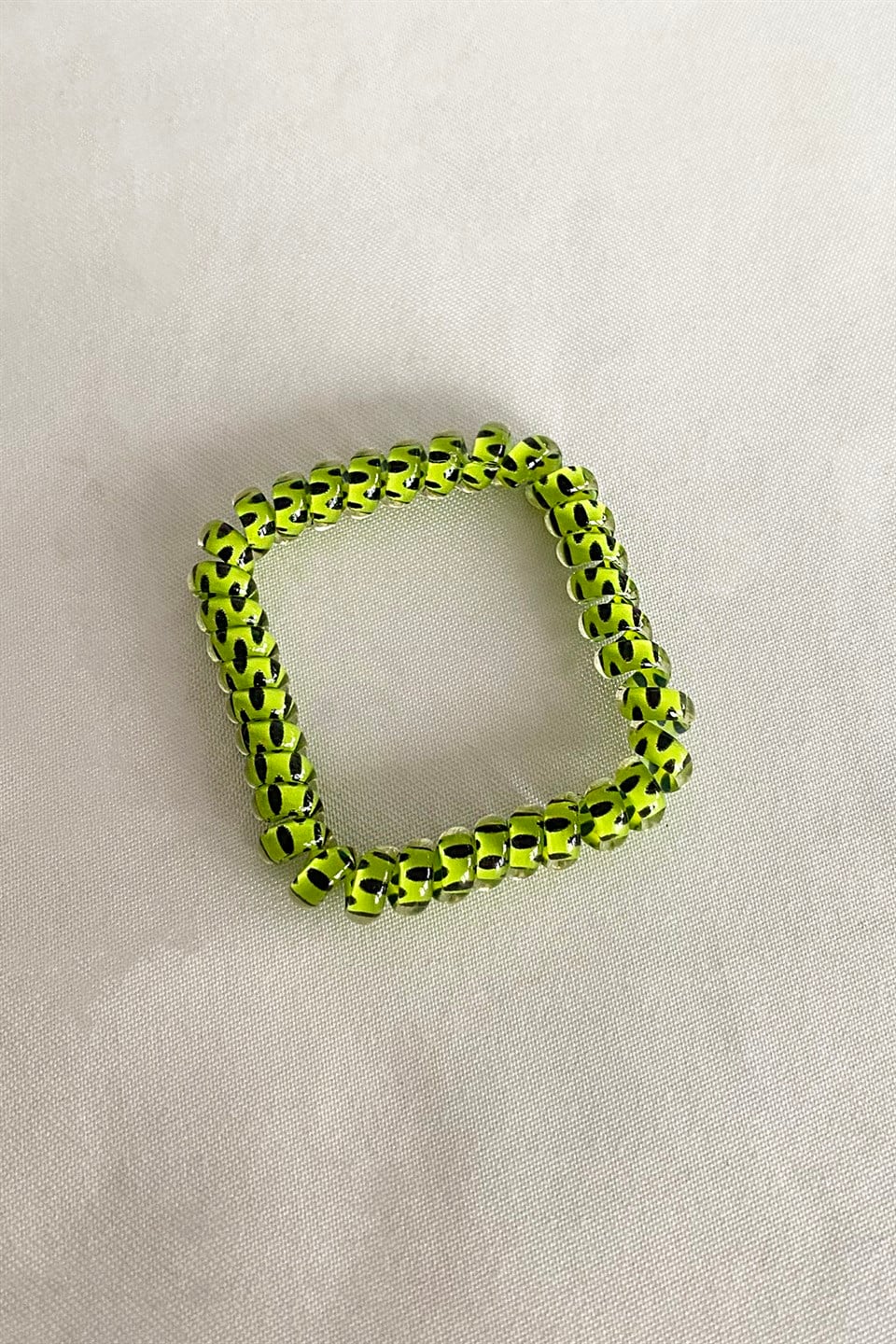 Green color polka dot spiral tire buckle