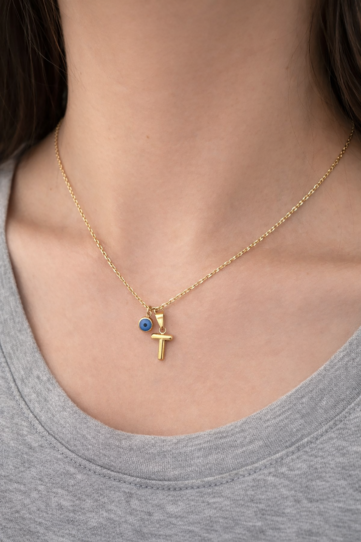 Altın Renk T Harfli Nazar Boncuk Detaylı Çelik Kolye
