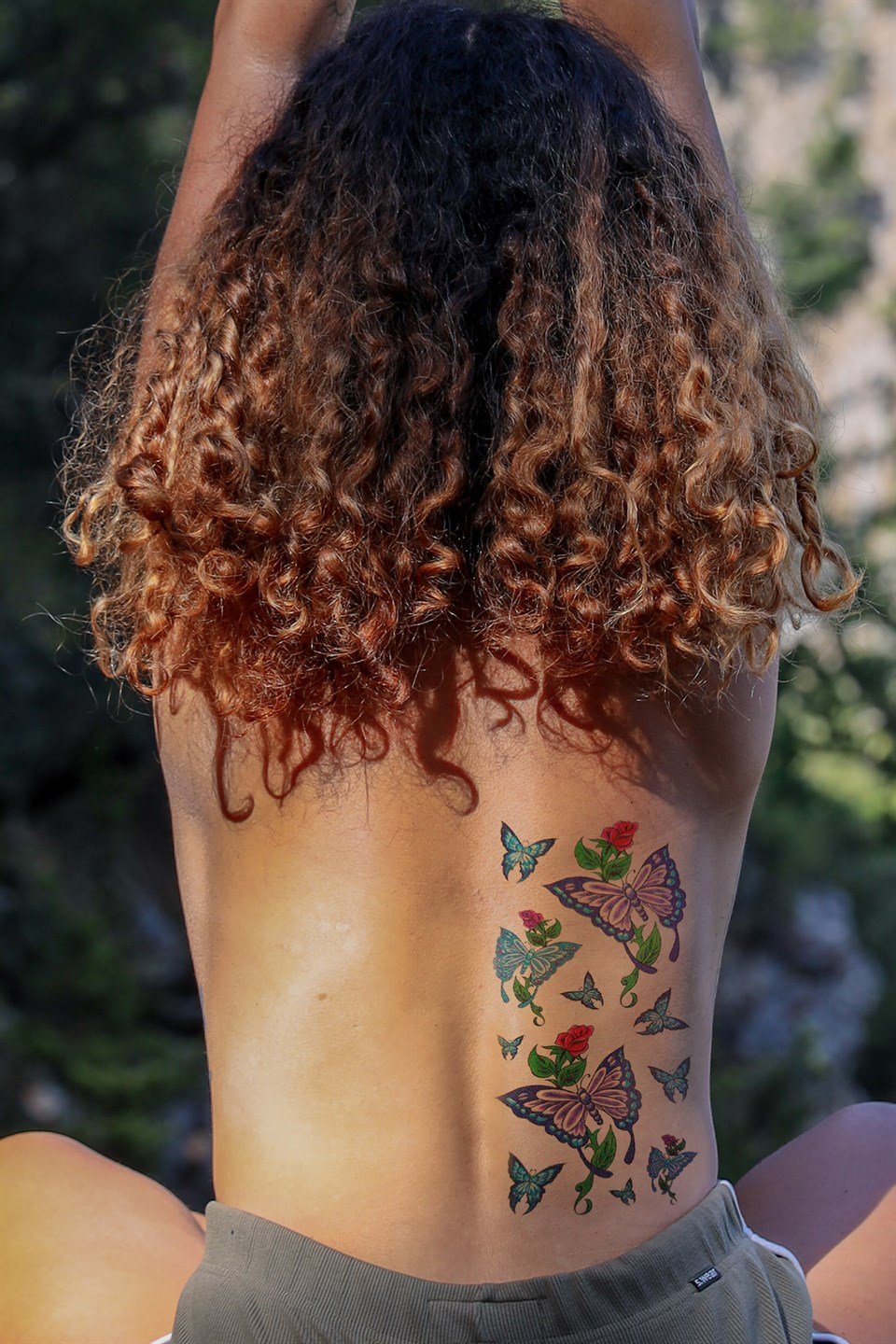 Black Butterfly on Arm Tattoo Idea