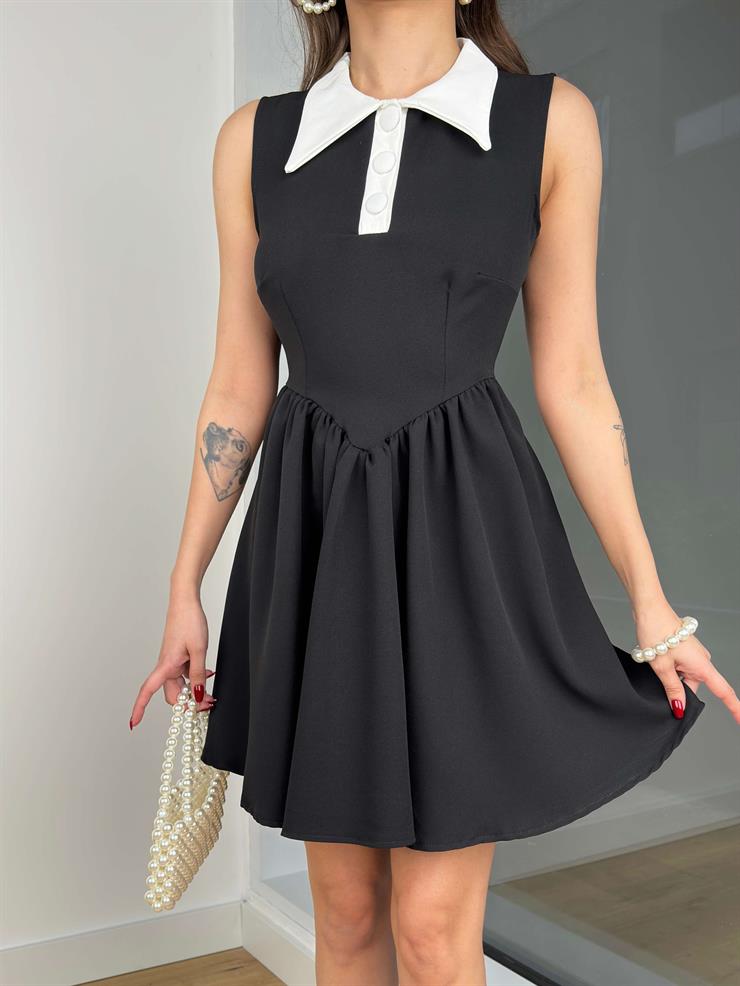 Önlük Yaka Kolsuz Eteği Volanlı İngvar Kadın Siyah Mini Elbise 24Y191