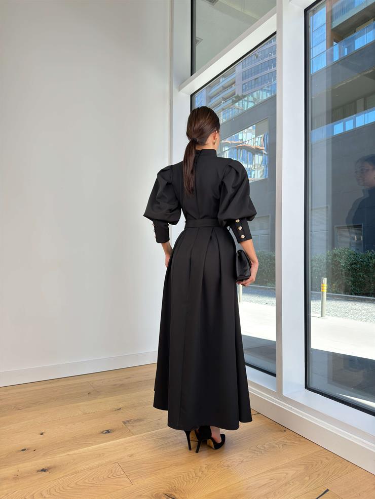 Yarım Boğazlı Balon Kol Beli Kemerli Kaspars Siyah Kadın Uzun Elbise 25K222