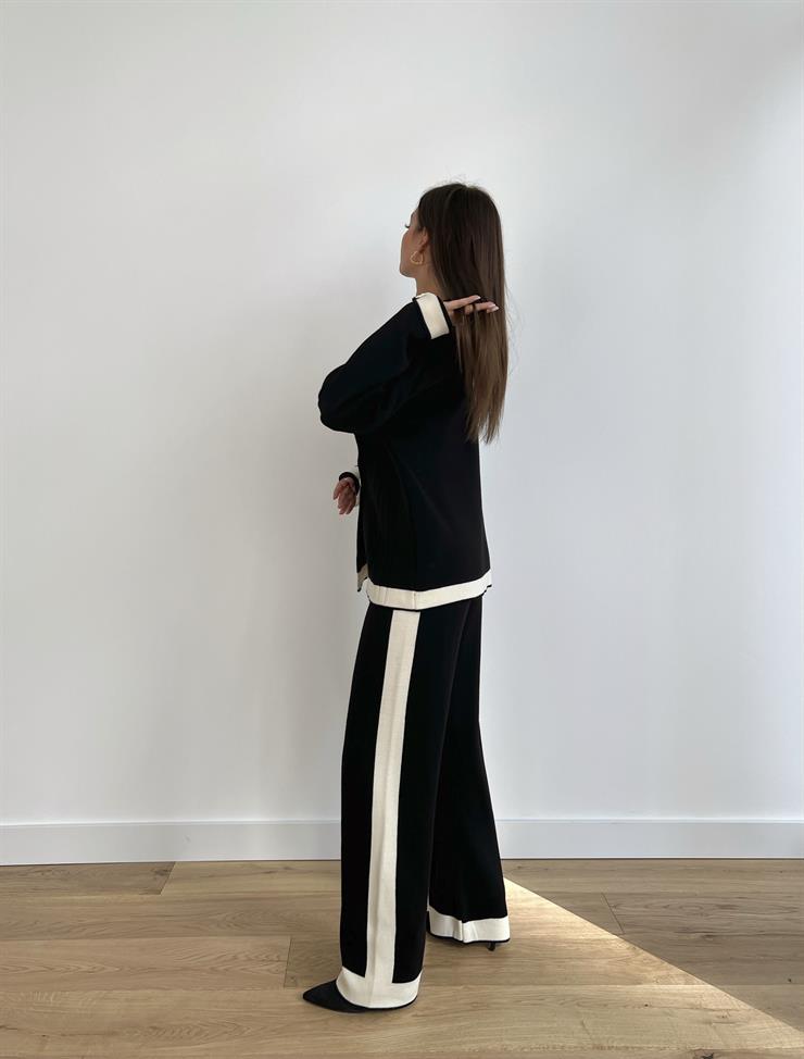 Asimetrik Yaka Önü Düğmeli Kazak Bol Paça Pantolon Roy Kadın Siyah Triko Takım 24k000026