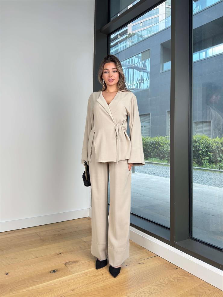 Uzun Kol Kruvaze Bağlamalı Bluz Yüksek Bel Bol Paça Pantolon Sıstin Bej Kadın Takım 25Y275