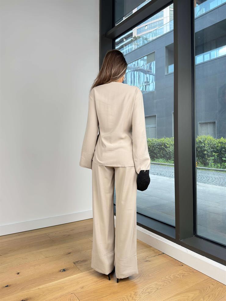 Uzun Kol Kruvaze Bağlamalı Bluz Yüksek Bel Bol Paça Pantolon Sıstin Bej Kadın Takım 25Y275