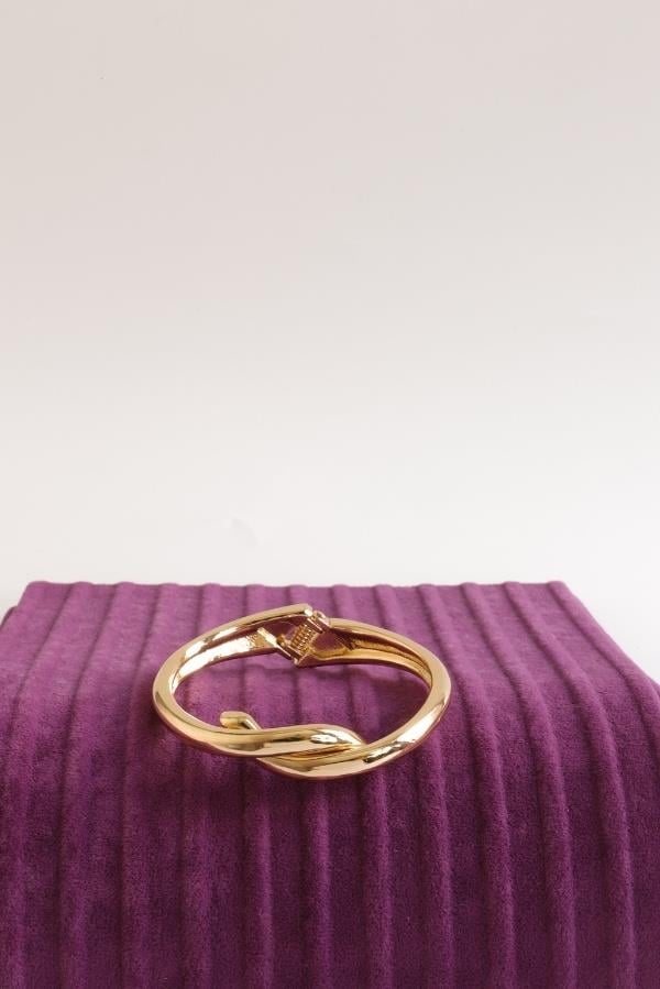  Handschelle mit Goldknotenmuster