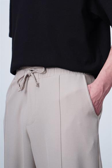 Krem Pileli Beli Lastikli Kumaş EL Baggy Pantolon