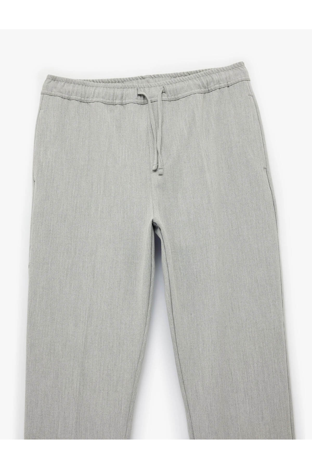 Regular Fit Cepli Beli Bağcıklı Kumaş Pantolon
