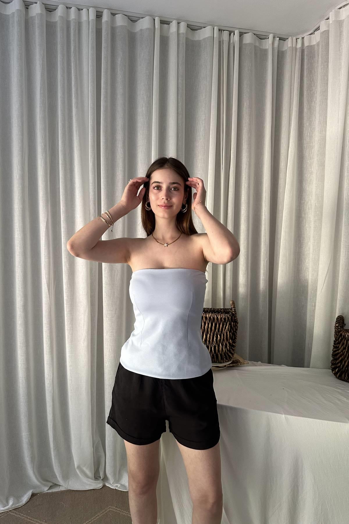 STRAPLEZ PEPLUM TOP
