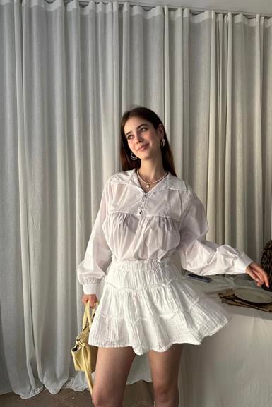 KISA PATLI BİRİT DÜĞME DETAYLI BLUZ