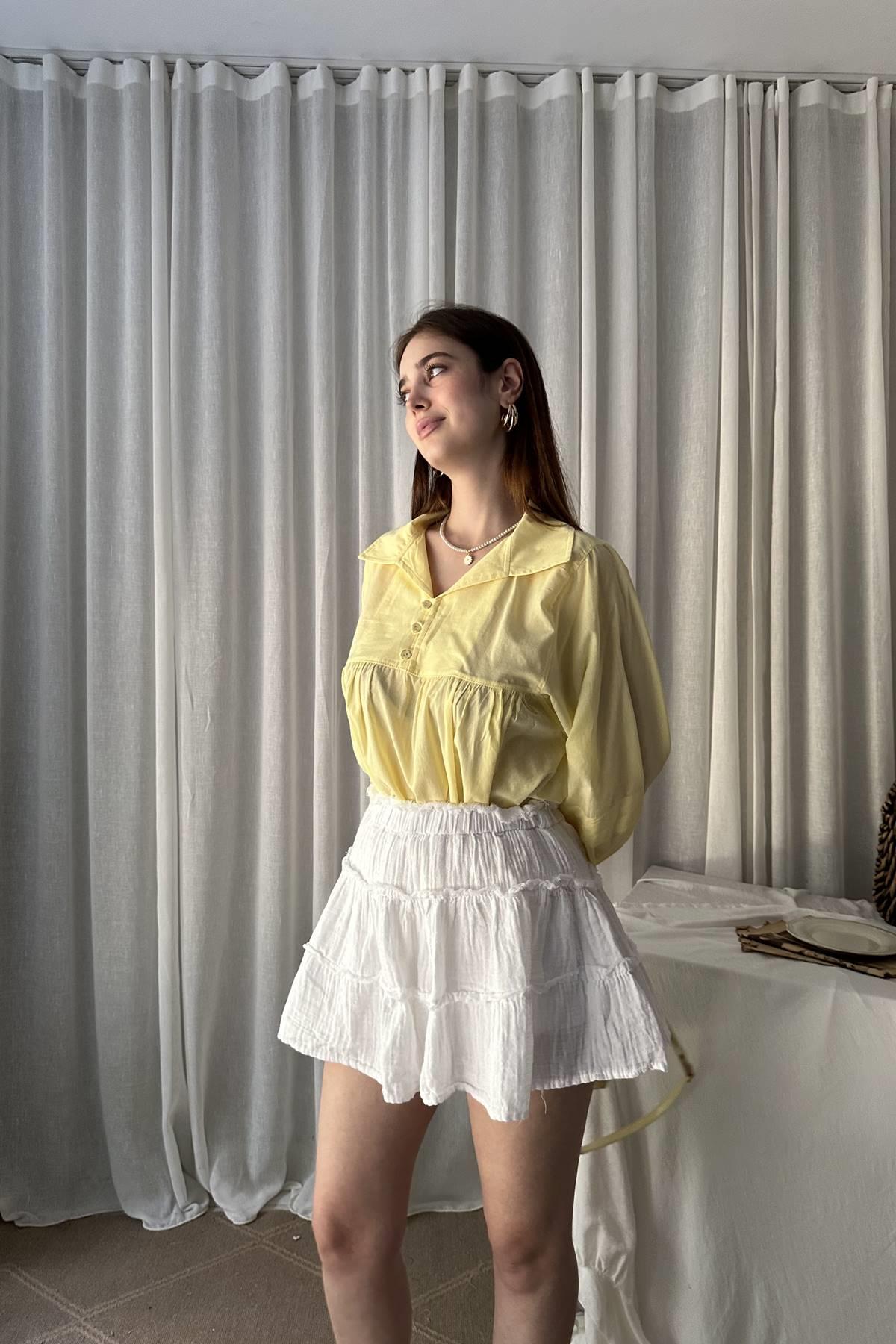 KISA PATLI BİRİT DÜĞME DETAYLI BLUZ