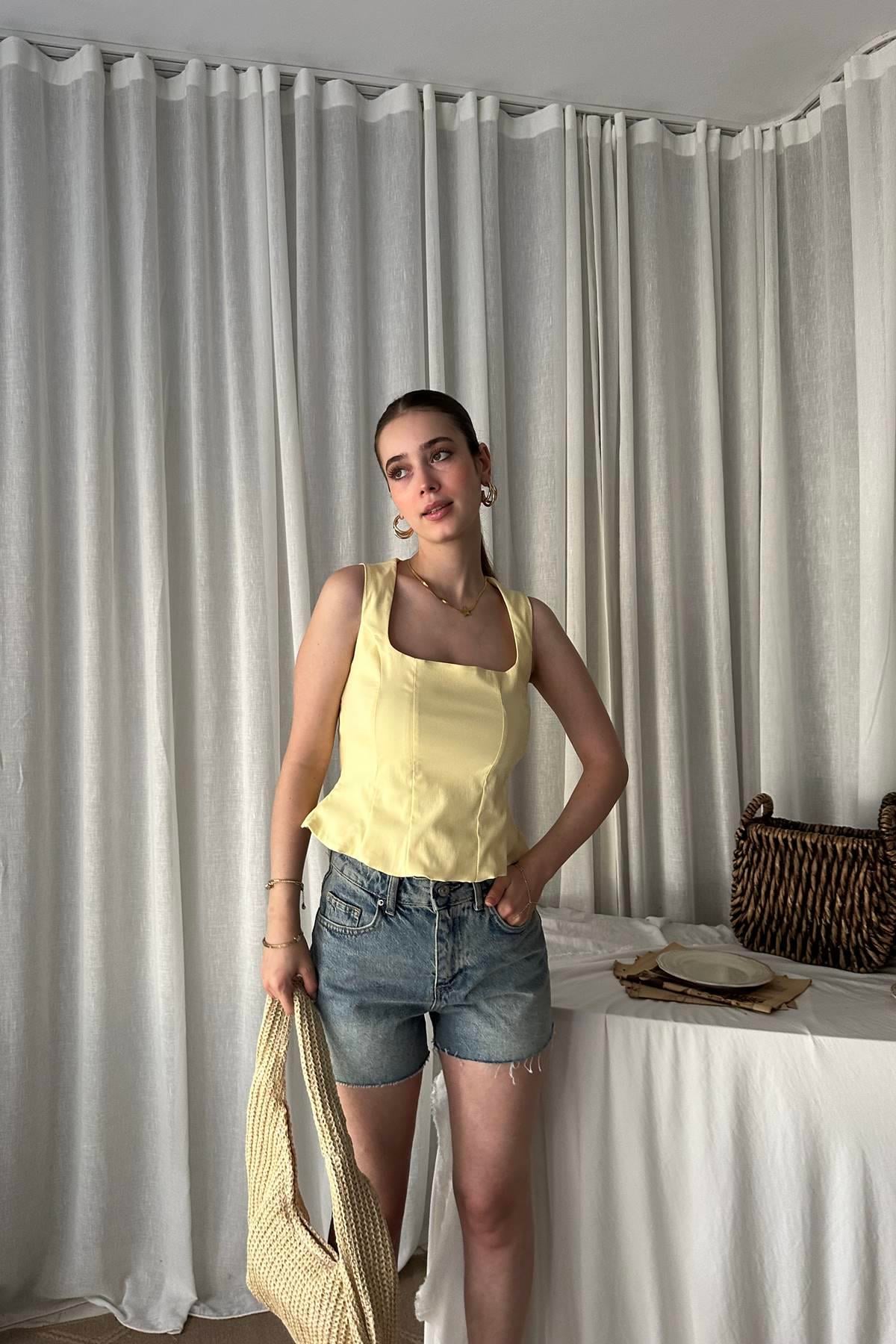 PEPLUM KORSE TOP