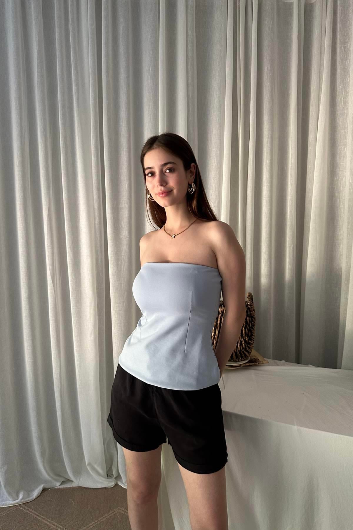 STRAPLEZ PEPLUM TOP