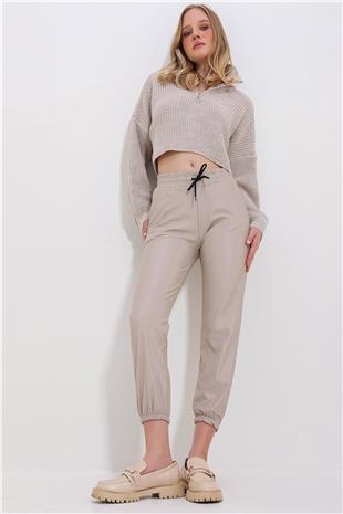 Kadın Bej Çift Cepli Bel Ve Bilek Lastikli İçi Şardonlu Casual Suni Deri Pantolon ALC-X7329