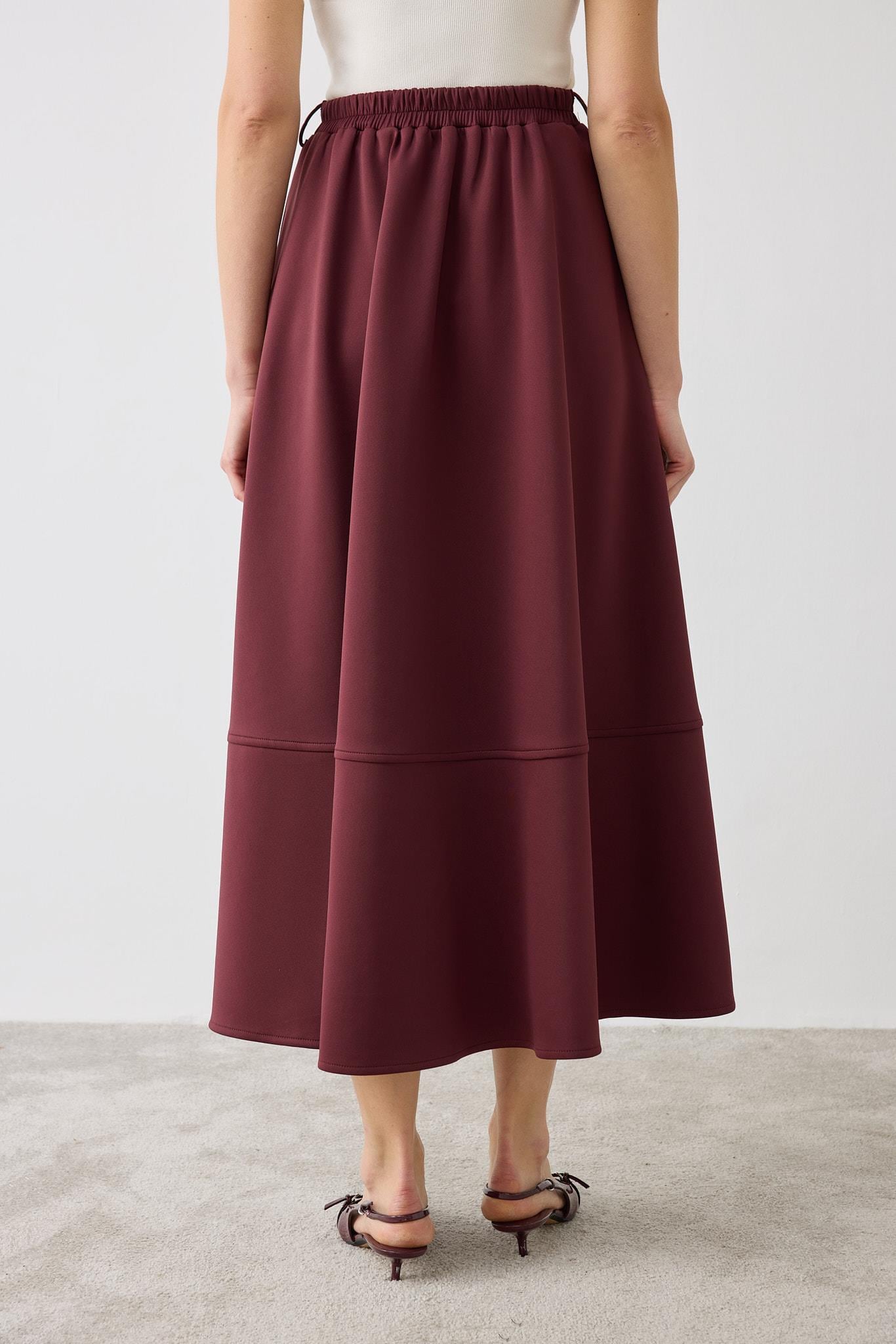 MIRA SCUBA PANELED FLARED SKIRT BURGUNDY
