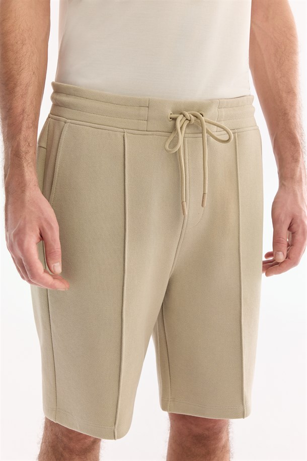 Bej Beli Lastikli Yandan Cepli Nervürlü Pike İnterlok Şort