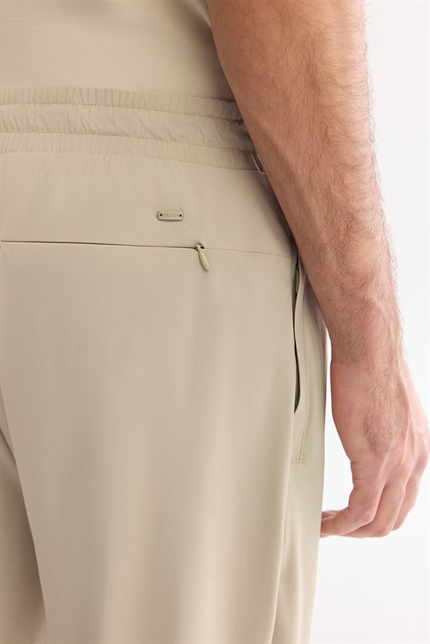 Bej Beli Lastikli Kırışmaz Hızlı Kuruyan Teknik Kumaş Eşofman Altı