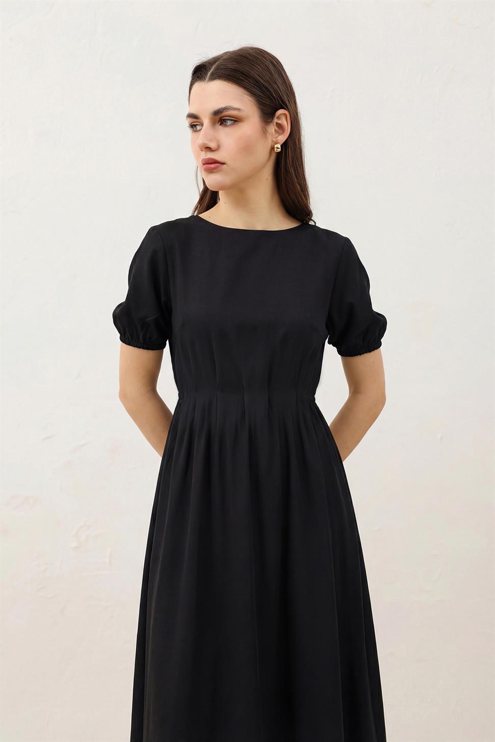 فستان نسائي بأكمام بالون بطول متوسط