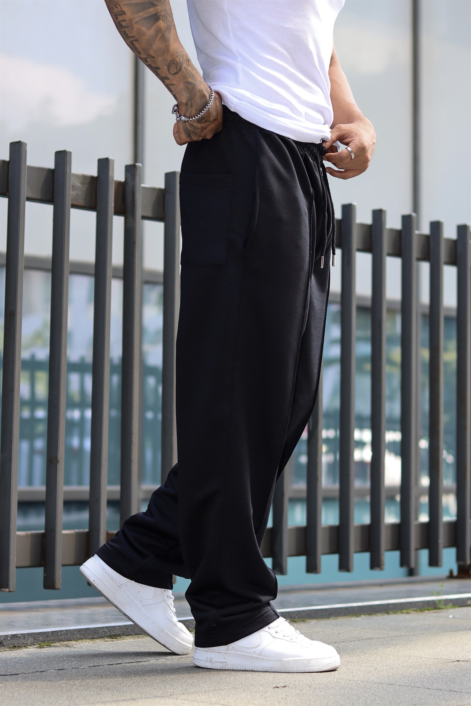 Baggy shiny black sweatpants