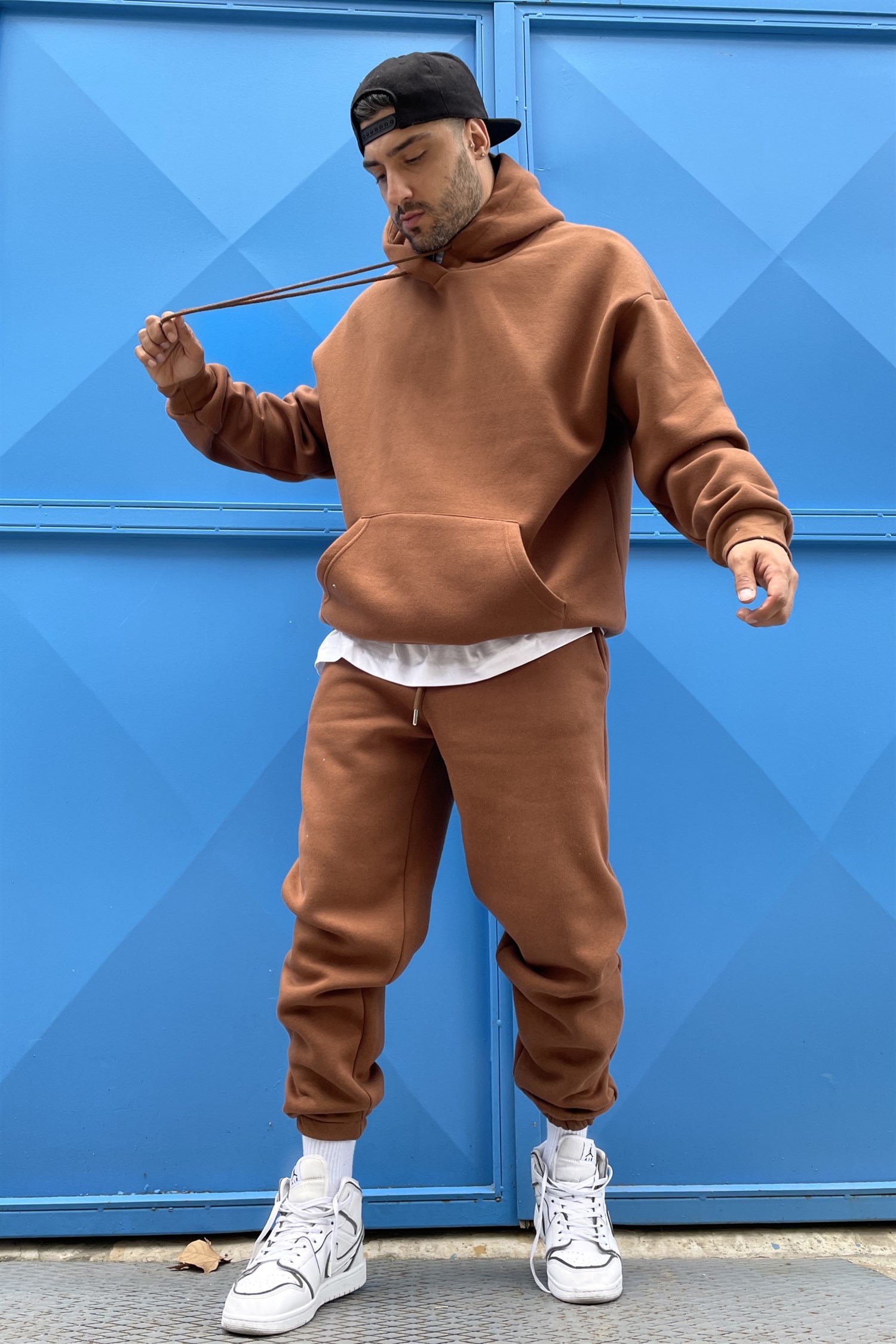 brown track suit
