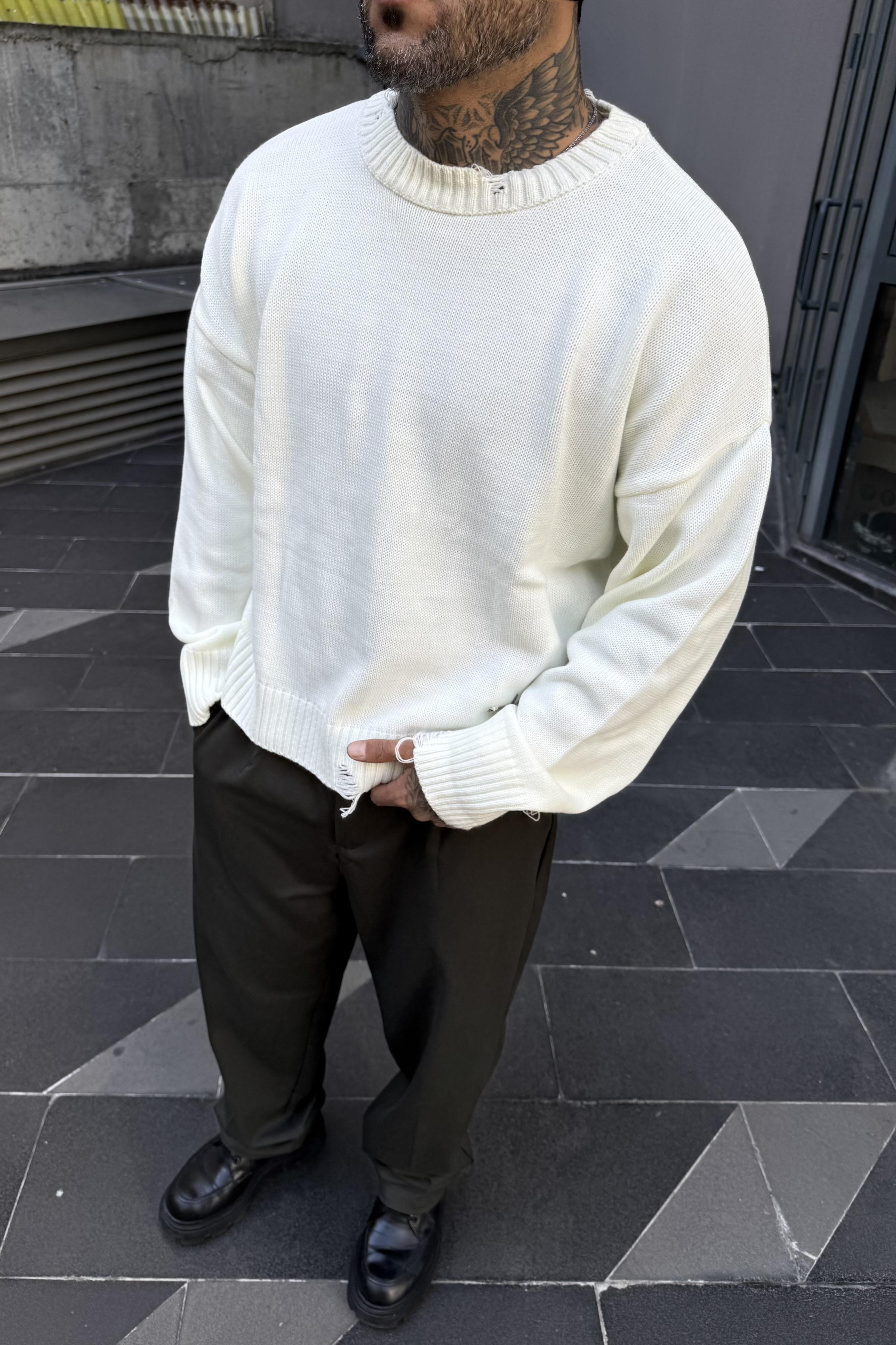Distressed oversize white sweater