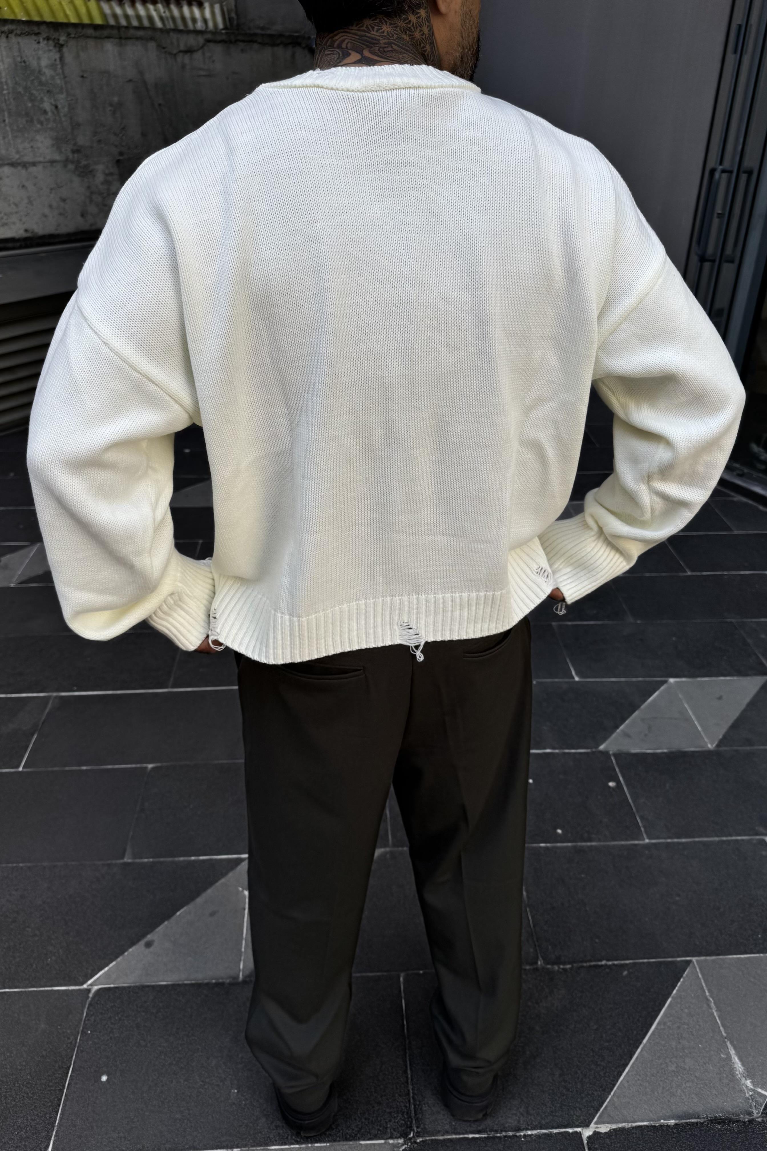 Distressed oversize white sweater
