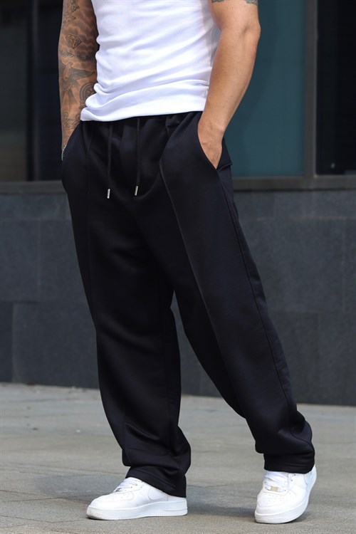 Baggy shiny black sweatpants