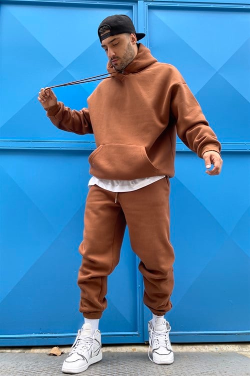 brown track suit