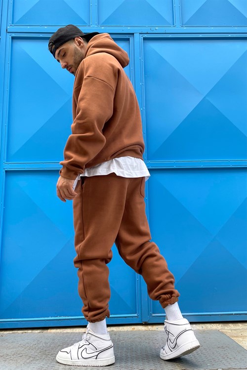 brown track suit
