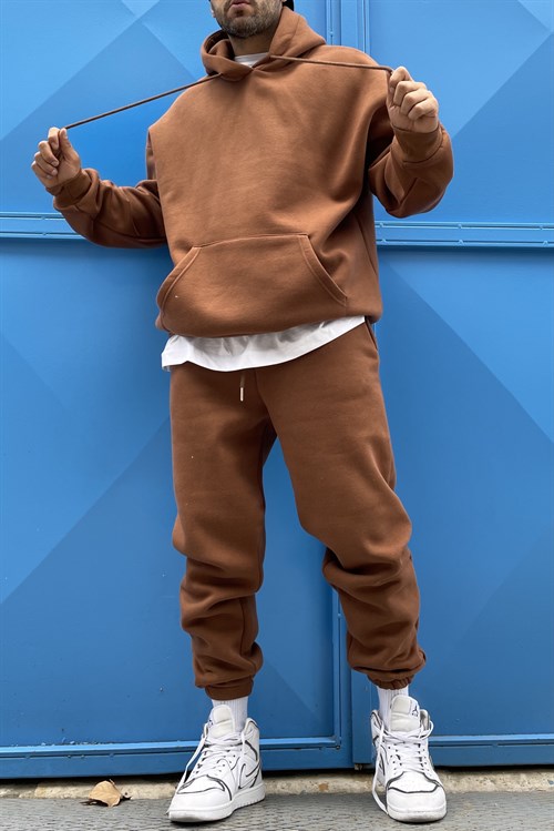 brown track suit