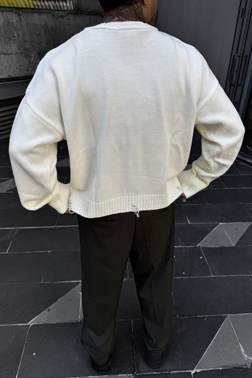 Distressed oversize white sweater