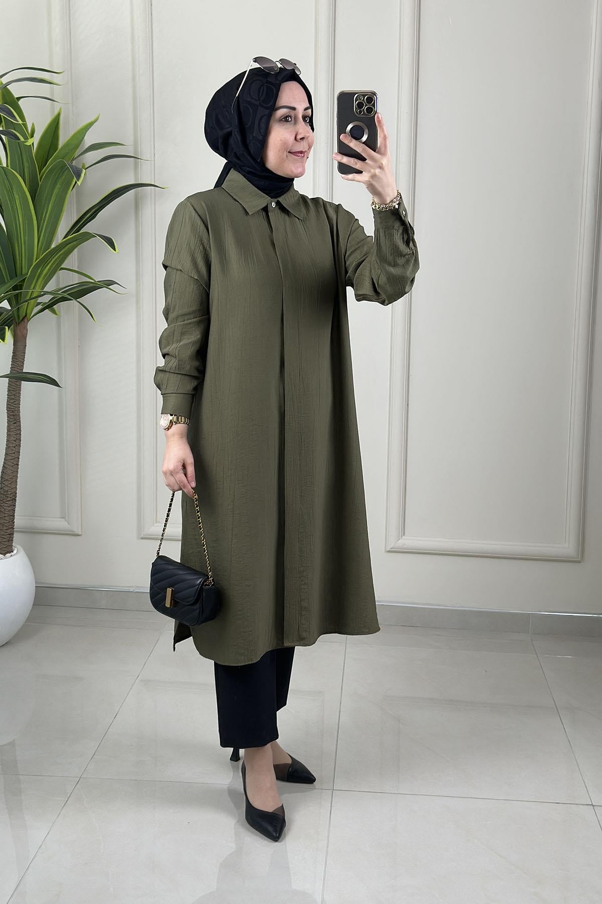 Tesettür Tunik ModelleriÖnü Gizli Düğmeli Yan Yırtmaç Detaylı Kadın Tunik Yeşil KADO 262228