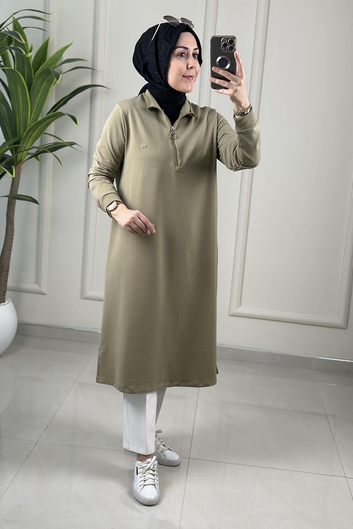 Tesettür Tunik ModelleriYaka ve Kol Ribanalı Önü Yarım Fermuarlı Kadın Tunik Yeşil KADO 257322