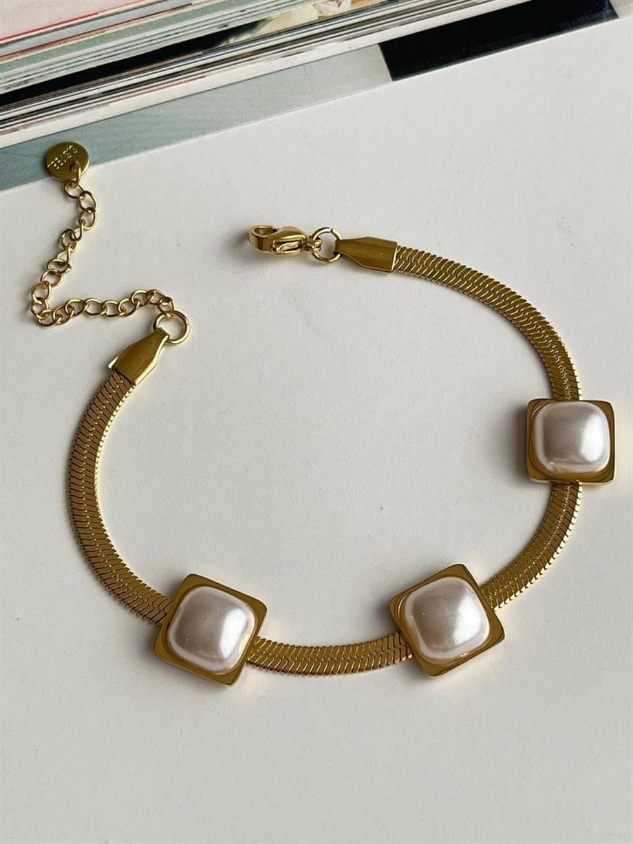 Çelik Gold Baget Taşlı Beyaz Sedefli Bileklik (22 Cm)