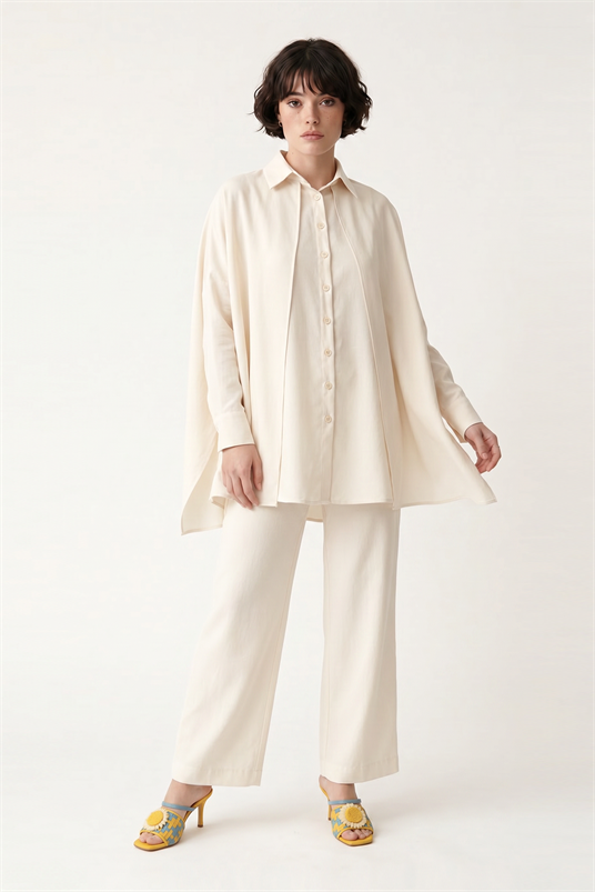 CUPRO ÖNDEN VE ARKADAN ÇİFT PELERİNLİ BLUZ