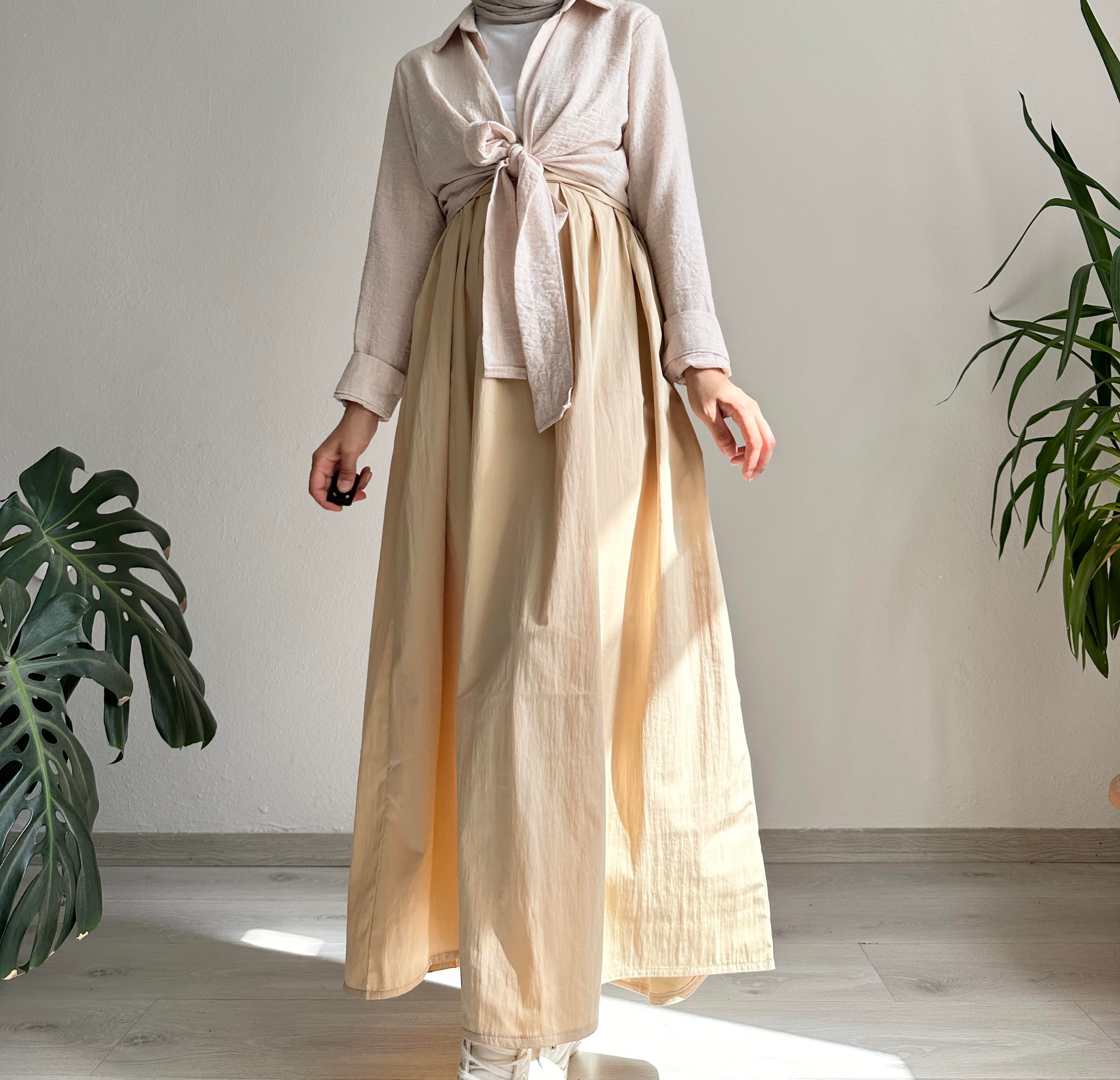 Bej Beli Kırmalı Kloş Etek