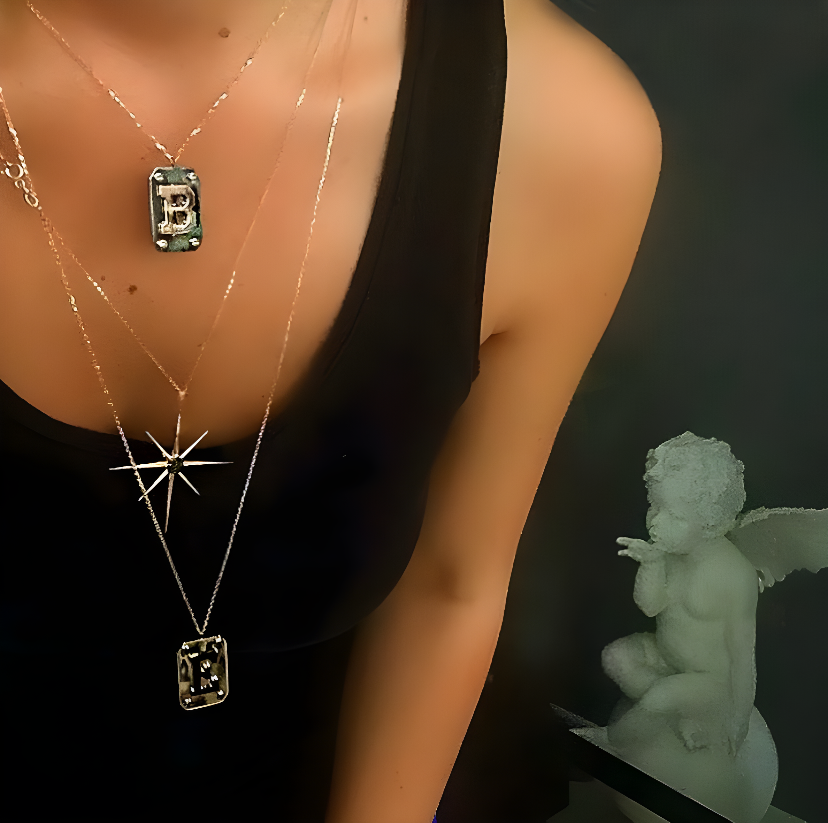 POINTED BLACK DIAMOND STAR GOLD EARRING