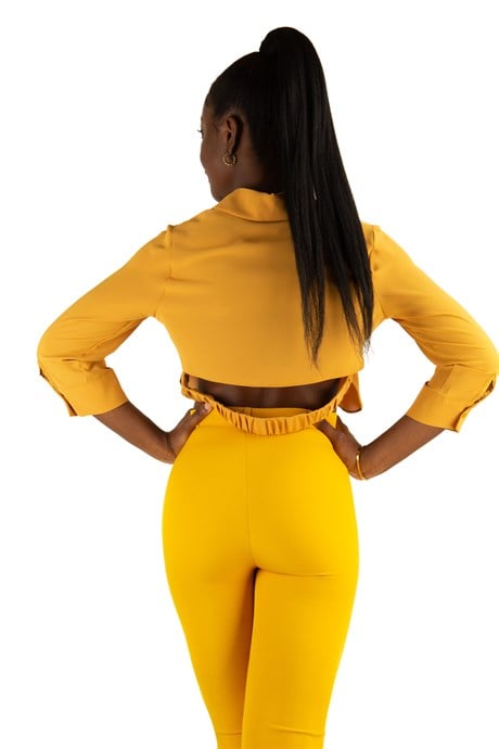 Berry Haute mustard yellow pants paired with a chiffon white top