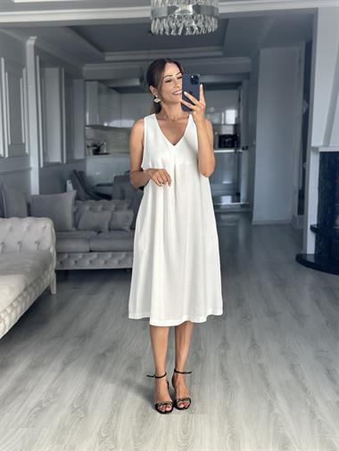 Beyaz Keten Önü Pensli V Yaka Sıfır Kol Cepli Kadın Midi Boy Elbise