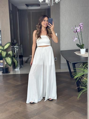 Beyaz Ters Dikiş Parçalı Bağcıklı Geniş Paça Kadın Pantolon