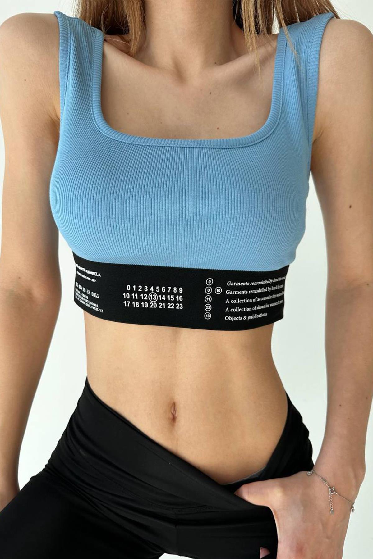 SUPPORTED CROP WITH WRITTEN WAIST DETAIL