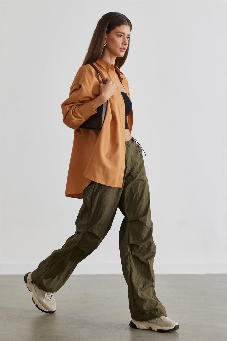 Tan oversized work shirt with olive cargo pants
