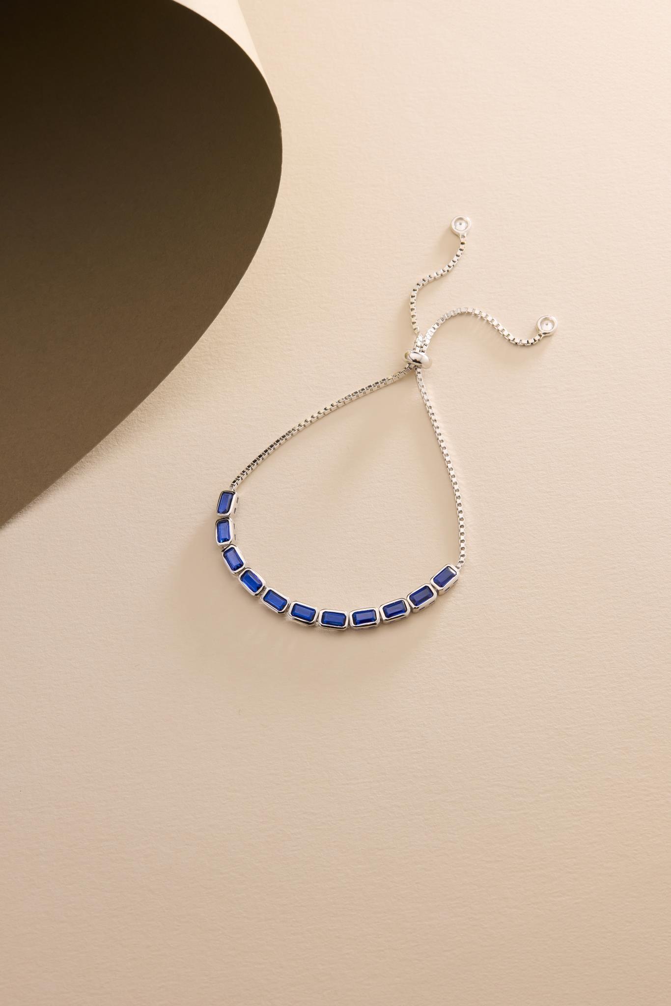 925 Ayar Gümüş Rodyum Kaplama Ayarlanabilir Asansörlü Sıralı Mavi Baget Taşlı Bileklik