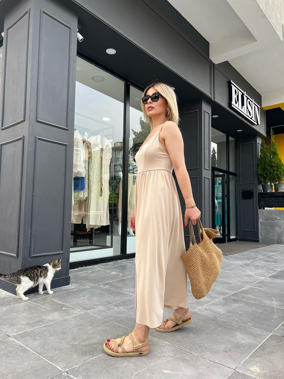 Beige Jumpsuit with Adjustable Straps and Wide Legs