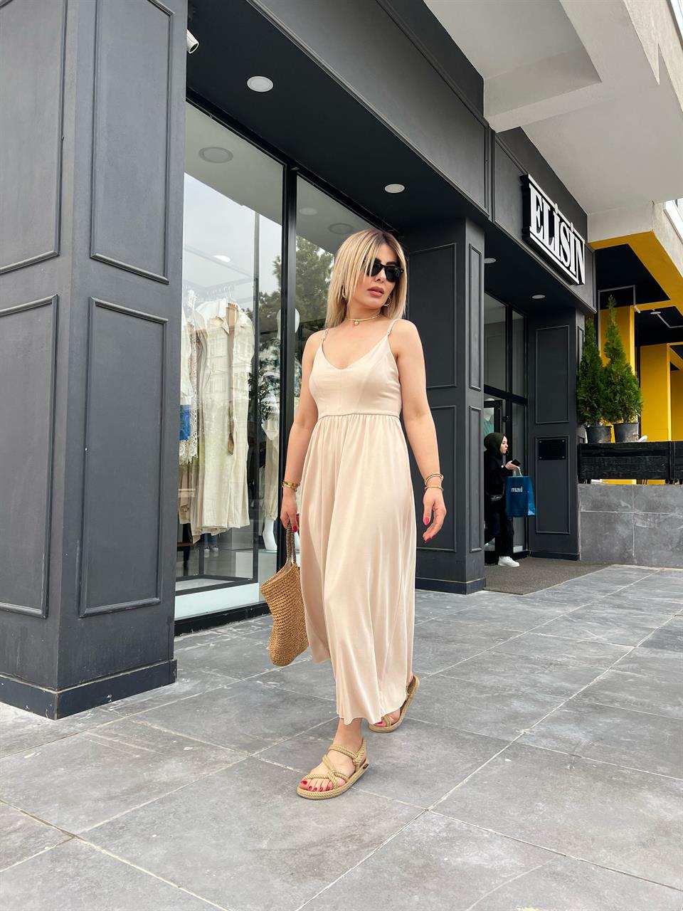 Beige Jumpsuit with Adjustable Straps and Wide Legs