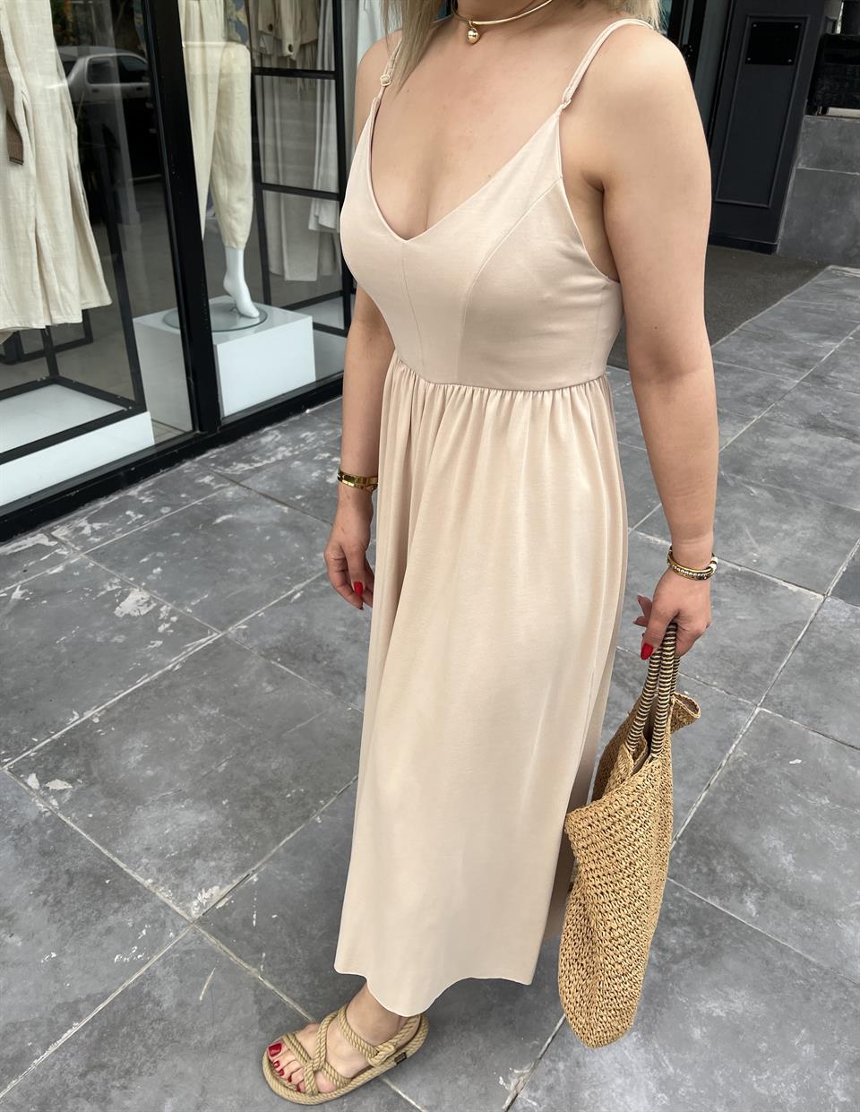 Beige Jumpsuit with Adjustable Straps and Wide Legs