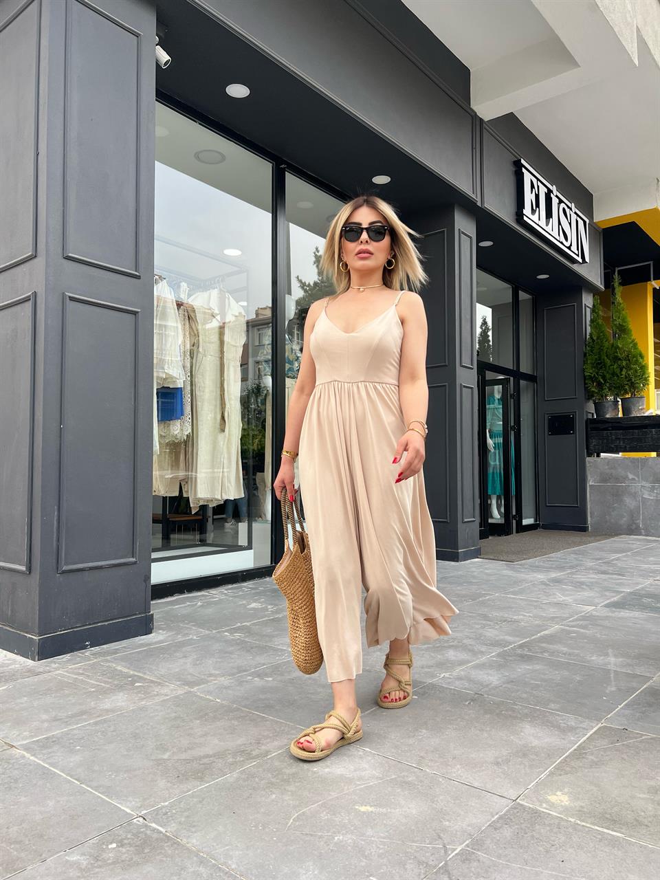 Beige Jumpsuit with Adjustable Straps and Wide Legs